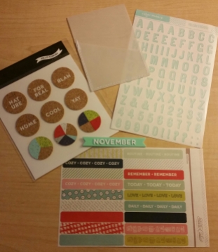Clockwise from top left: Cork circle stickers, vellum pocket, vellum alphas, rubber month banner, washi strips